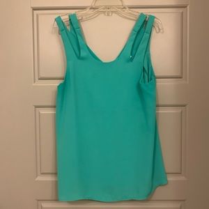 Green sleeveless blouse